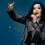 Featured image for an article about the 15 best female-fronted rock and metal covers of all time, featuring Tarja Turunen on stage