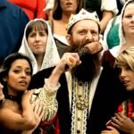 Killswitch Engage Holy Diver cover music video scene with a medieval king character and crowd