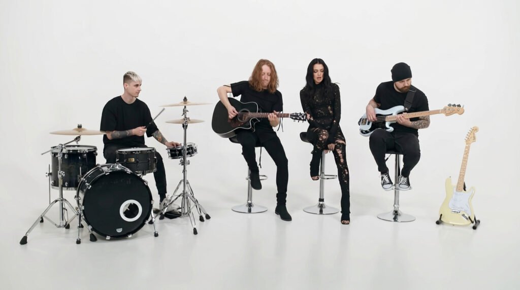 NOAPOLOGY performing Ashes Stripped Down Version in a minimalist white studio setting