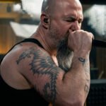 Archspire vocalist performs the band’s technical death metal cover of ROSÉ and Bruno Mars’ “APT.” for Musora’s On The Spot series.